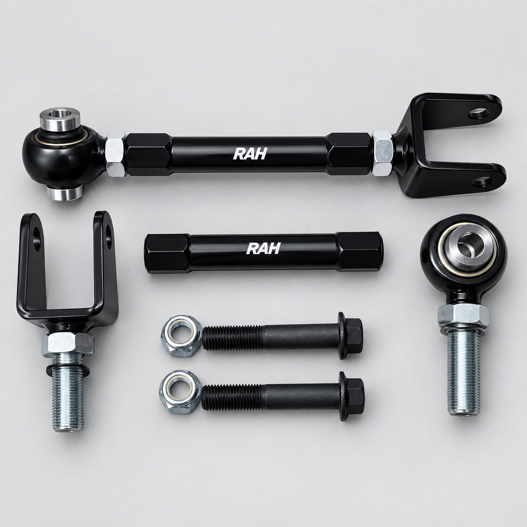A set of black metal automotive suspension or steering components, including ball joints, U-bolts, and mounting hardware, arranged on a light gray background. The components feature the white printed brand name 'RAH'.
