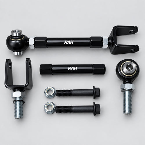 A set of black metal automotive suspension or steering components, including ball joints, U-bolts, and mounting hardware, arranged on a light gray background. The components feature the white printed brand name 'RAH'.